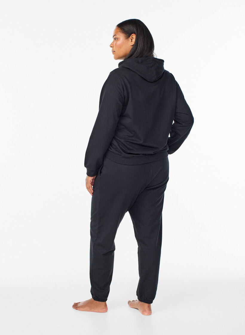 Jogginghosen mit Taschen, Schwarz, Model image number 1