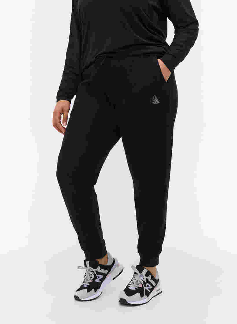 Einfarbige Trainingshose mit Taschen, Black, Model image number 2