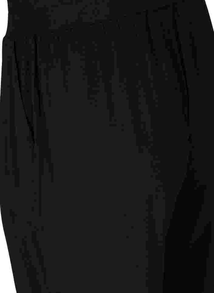 Lockere und dehnbare Trainingshose mit Taschen, Black, Packshot image number 3