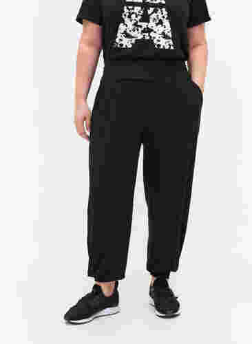 Lockere Sporthose aus Viskose mit Taschen, Black, Model image number 1