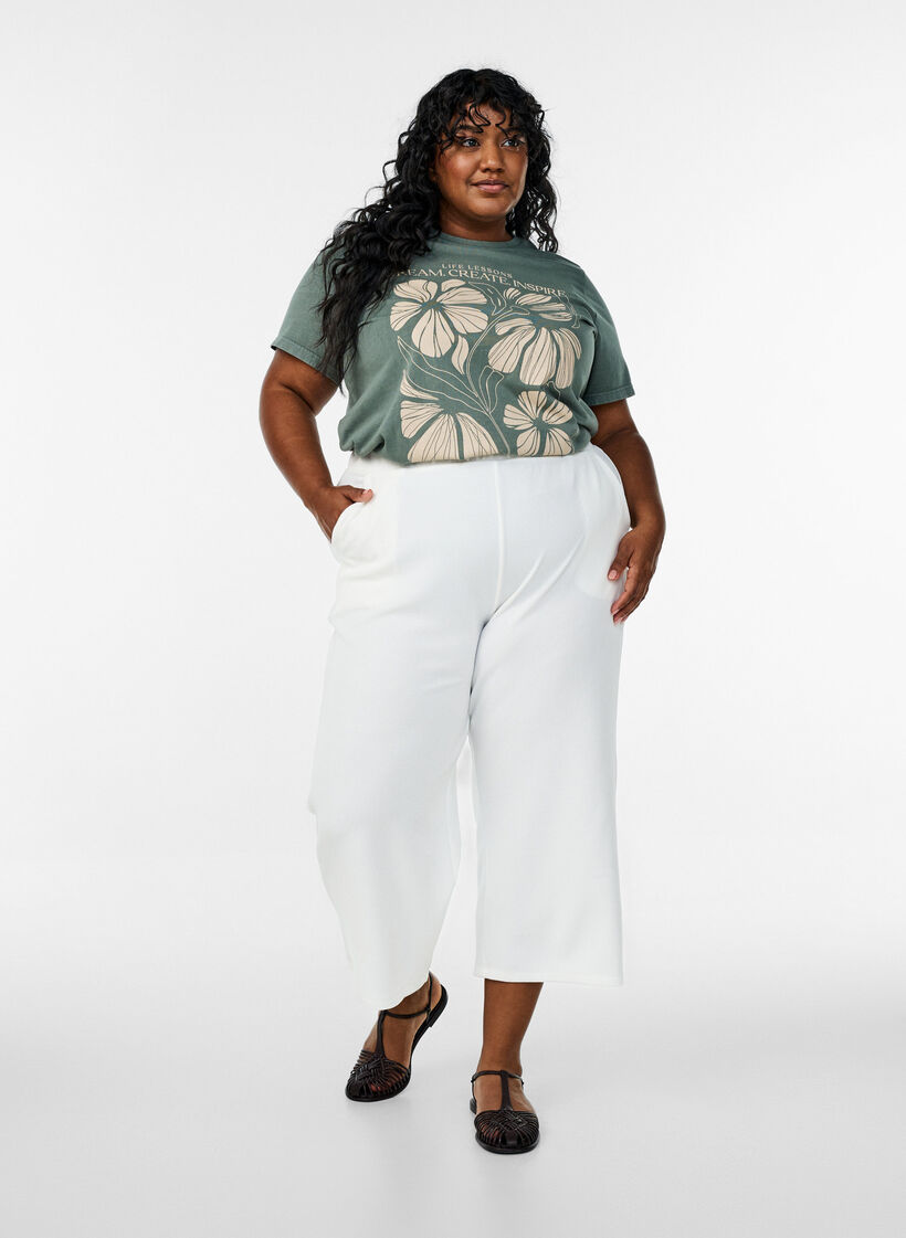 T-Shirt aus Bio-Baumwolle mit Textaufdruck und Blumenprint, Grün, Model image number 1