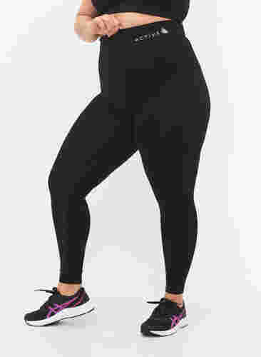 Nahtlose Workout-Leggings mit Struktur, Black, Model image number 2